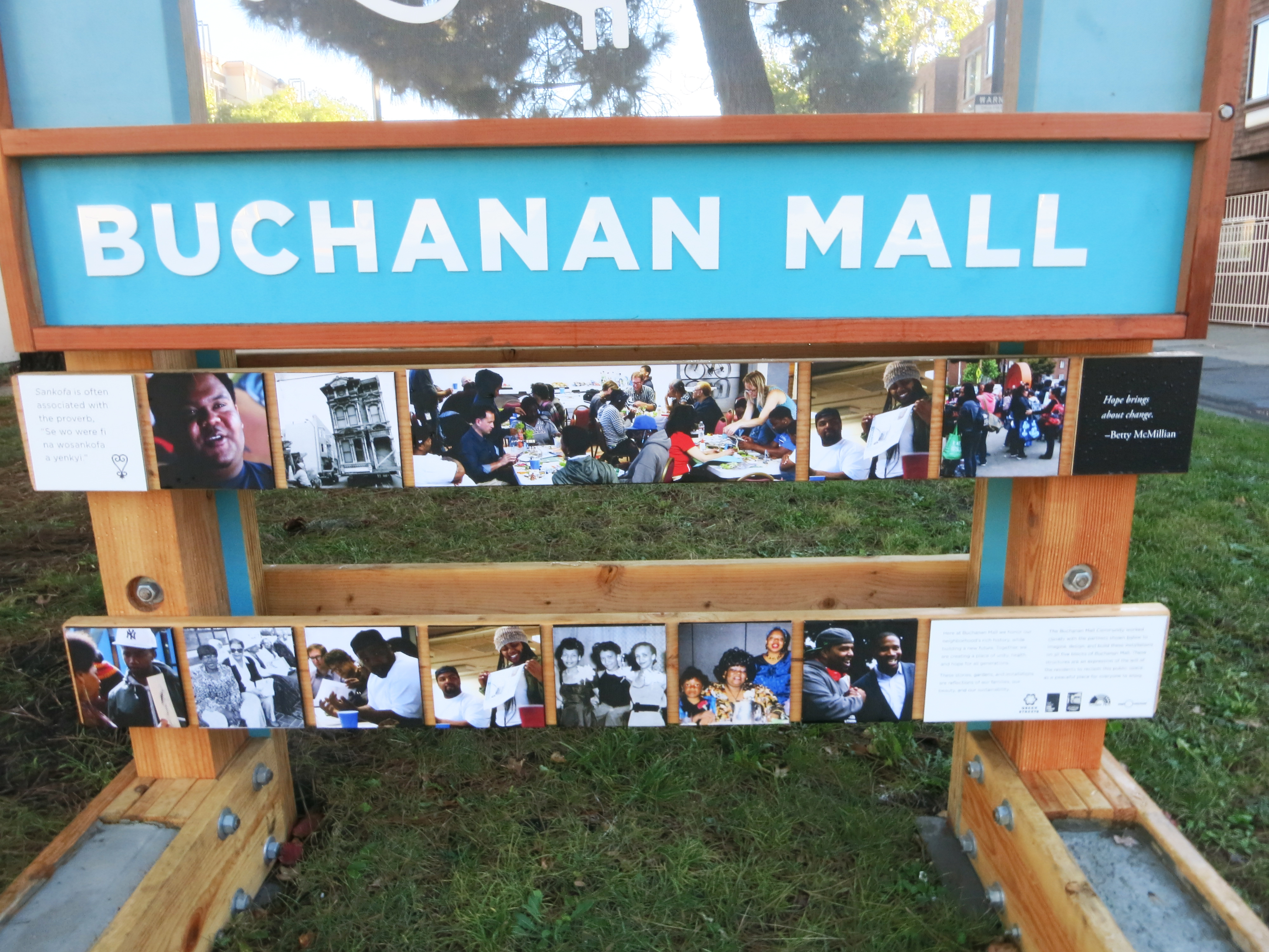 Buchanan Mall gateway displaying photographs of residents and community activities